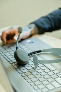 Close-Up View of a Laptop and a Headset